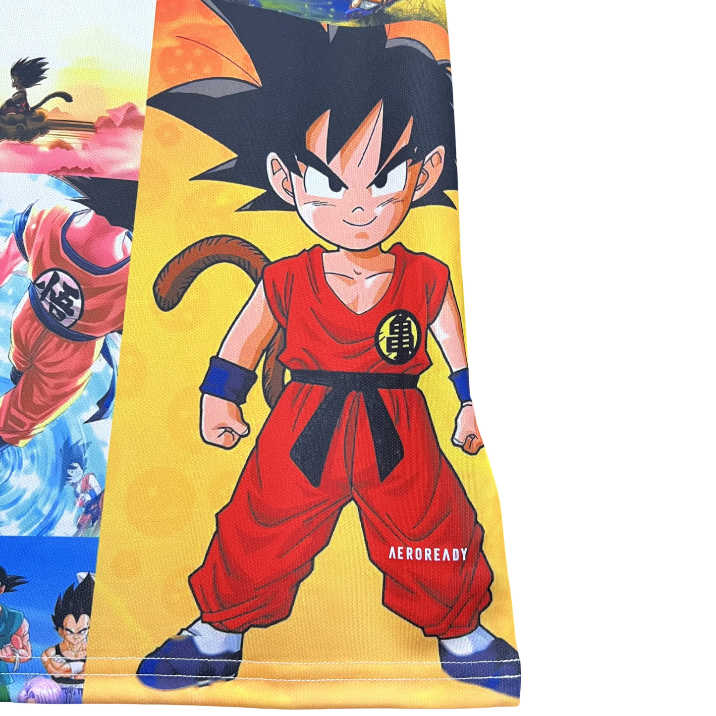Special edition Goku jersey with colorful mosaic design showing various Dragon Ball moments and characters