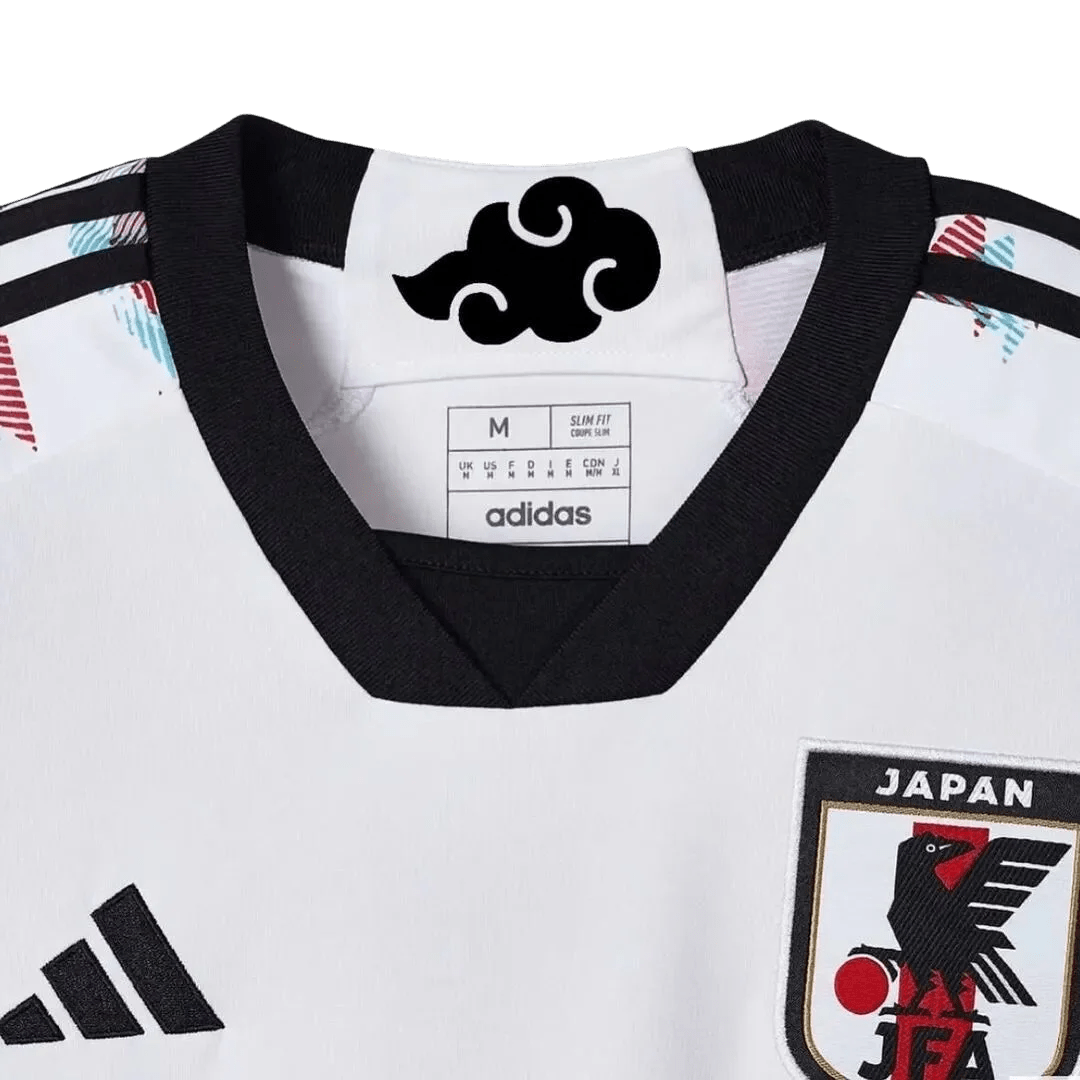 White Japan soccer jersey featuring anime-inspired design with Itachi Uchiha from Naruto, black crows, Konoha symbol, Adidas logo, and Japan national team crest