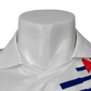 White polo shirt with red and blue accents on a mannequin against a white background