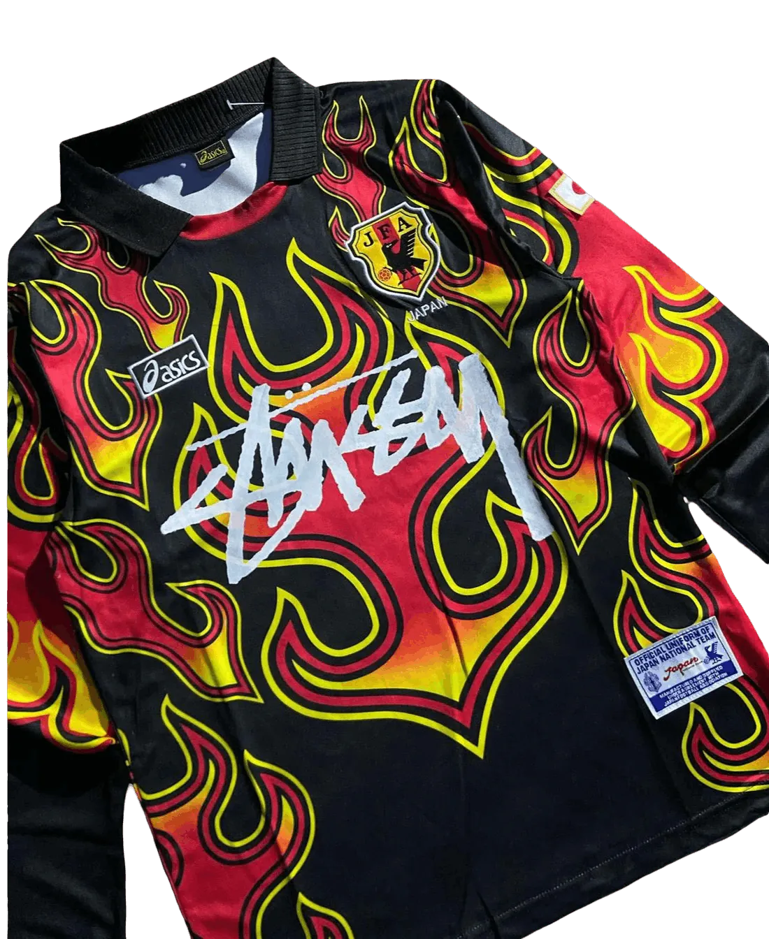 Angled flat lay of 1998 Japan goalkeeper long sleeve black flame jersey with Stussy graphic