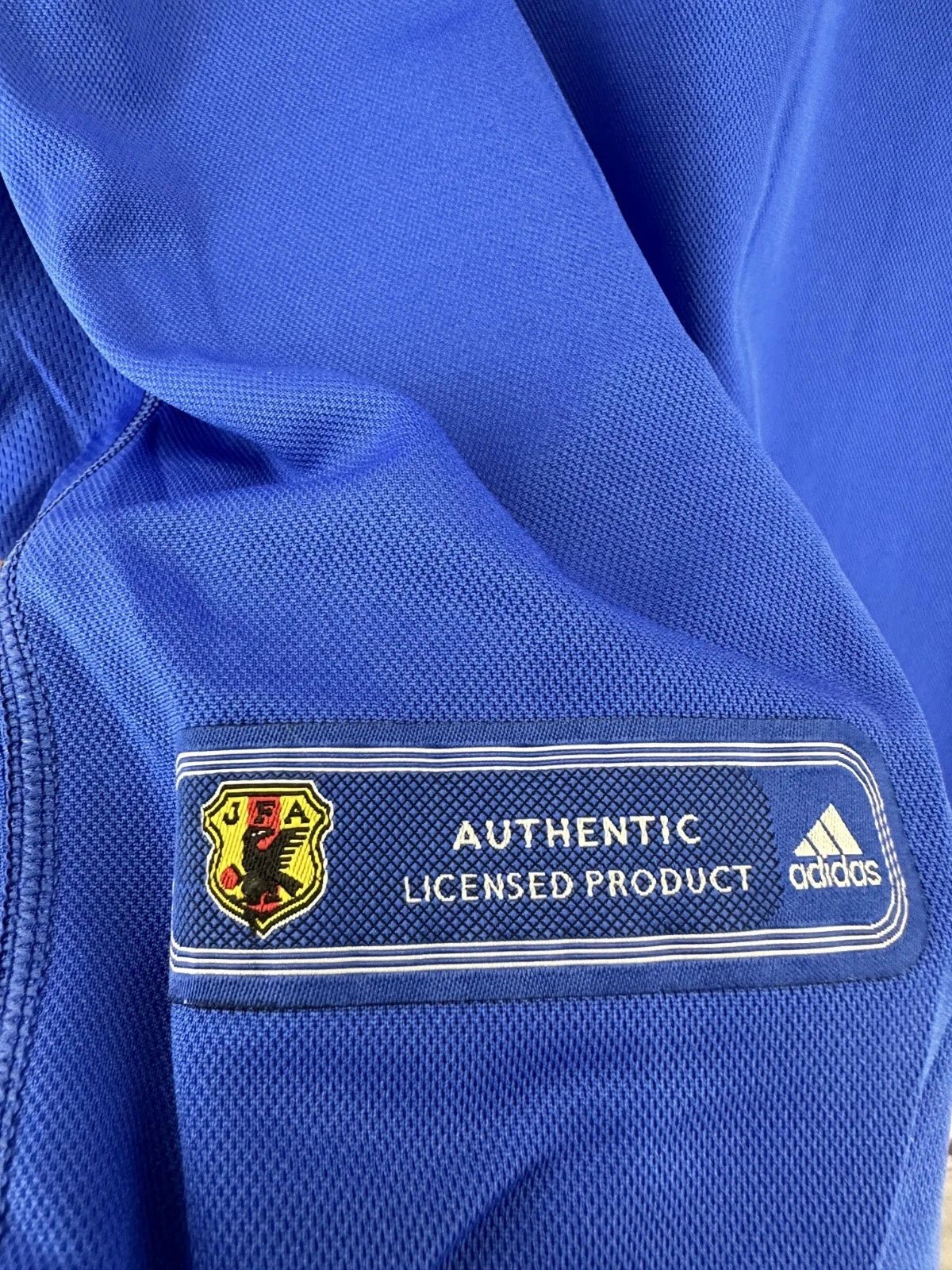 Japan Home Jersey 2000 red flame sleeve graphics JFA crest embroidered early 2000s design detail