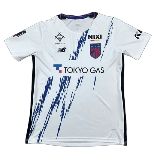 FC Tokyo away jersey 2026-27 fan version front view white with navy brush strokes Tokyo Gas sponsor