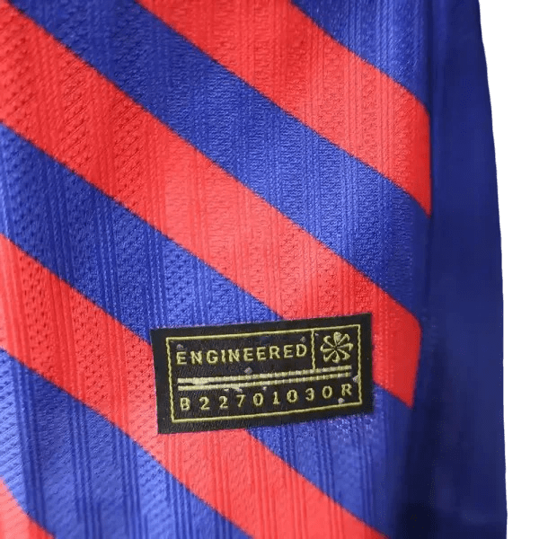 FC Barcelona inspired soccer jersey featuring a vibrant blue and red design with an illustration of Luffy from One Piece in the center, radiating red stripes, and the FCB club crest on the chest