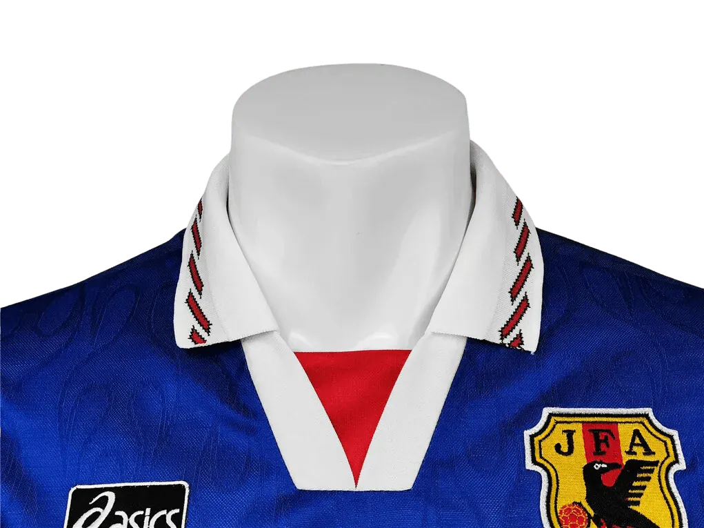 Blue sports jersey with white collar and red accents on a mannequin against a white background