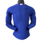 Back view of Japan 2026 home player jersey long sleeve showing wave pattern across shoulders and Samurai blue color