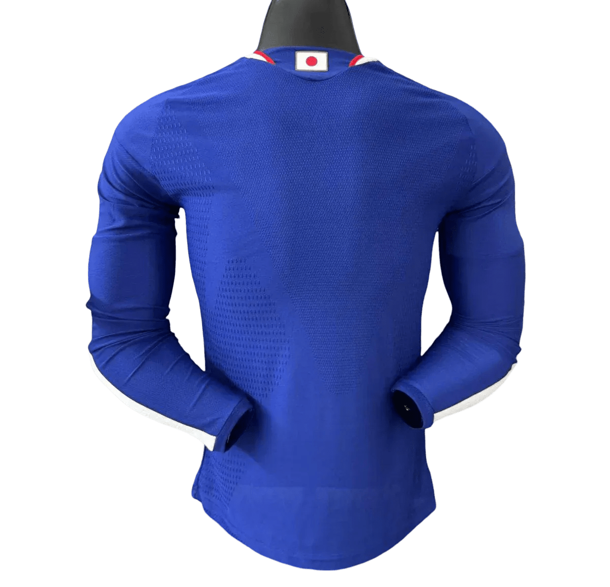 Back view of Japan 2026 home player jersey long sleeve showing wave pattern across shoulders and Samurai blue color