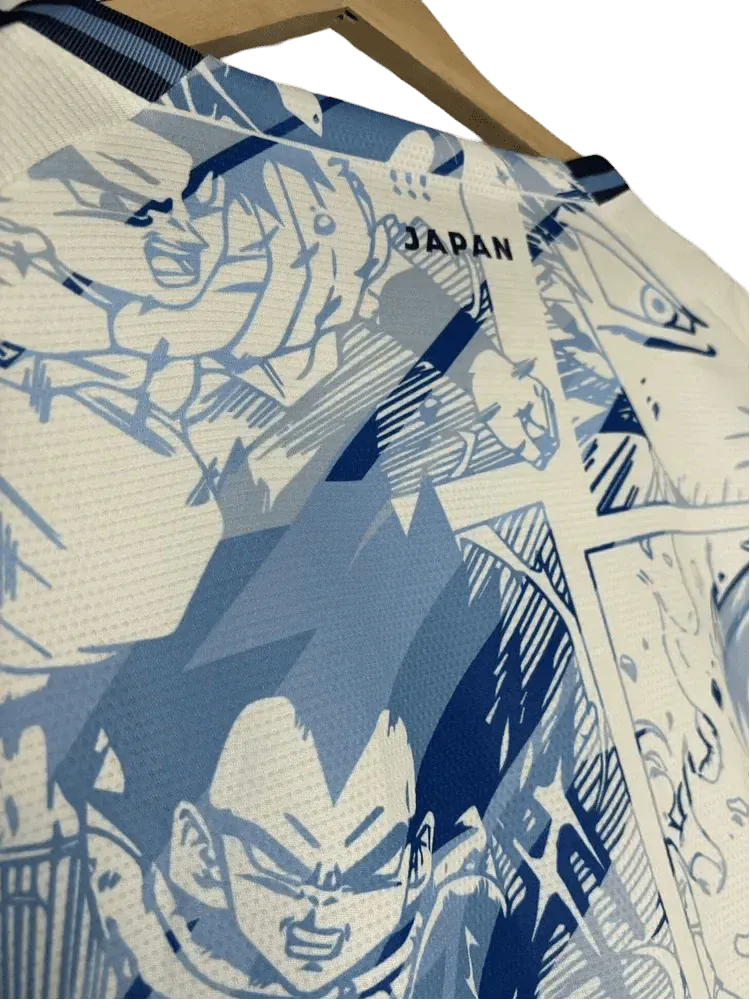 Japan soccer jersey with Dragon Ball manga panels in blue and pink design combining anime artwork and JFA branding