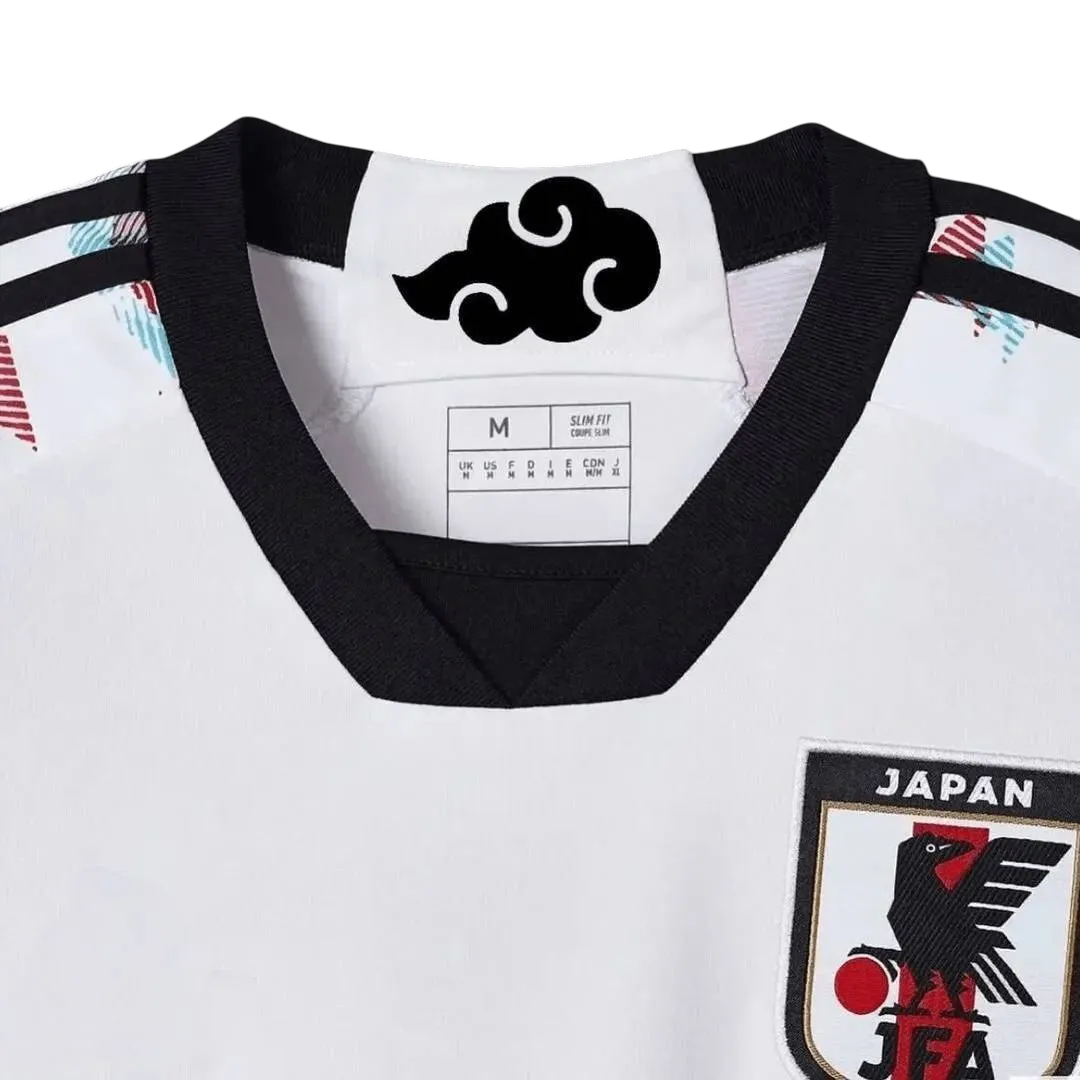 White Japan soccer jersey featuring anime-inspired design with Itachi Uchiha from Naruto, black crows, Konoha symbol, Adidas logo, and Japan national team crest