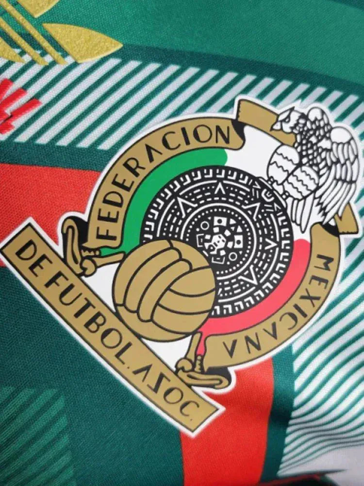 Collector Mexico football jersey in green with layered chevron graphics across the front and tricolor details
