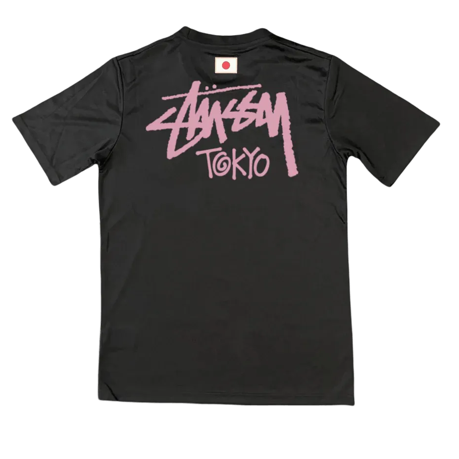 Back view of black Stussy Japan jersey with large pink Stussy Tokyo print