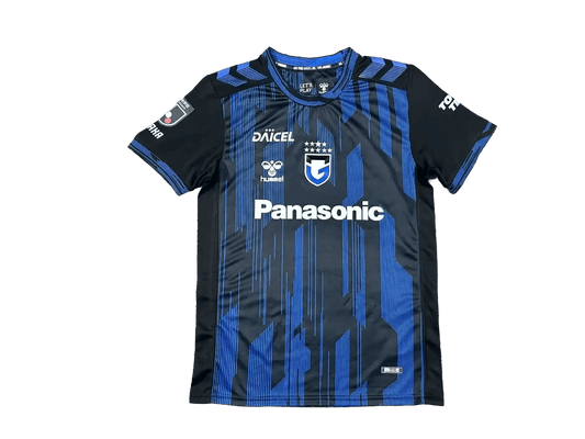 Gamba Osaka 2026/27 home jersey front in black with blue glitch stripes and Panasonic sponsor