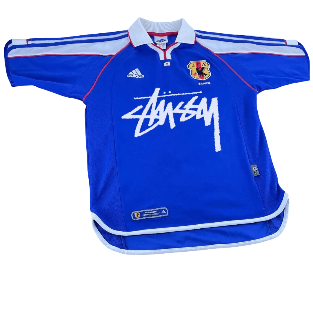 Blue sports jersey with white text and logos on a white background