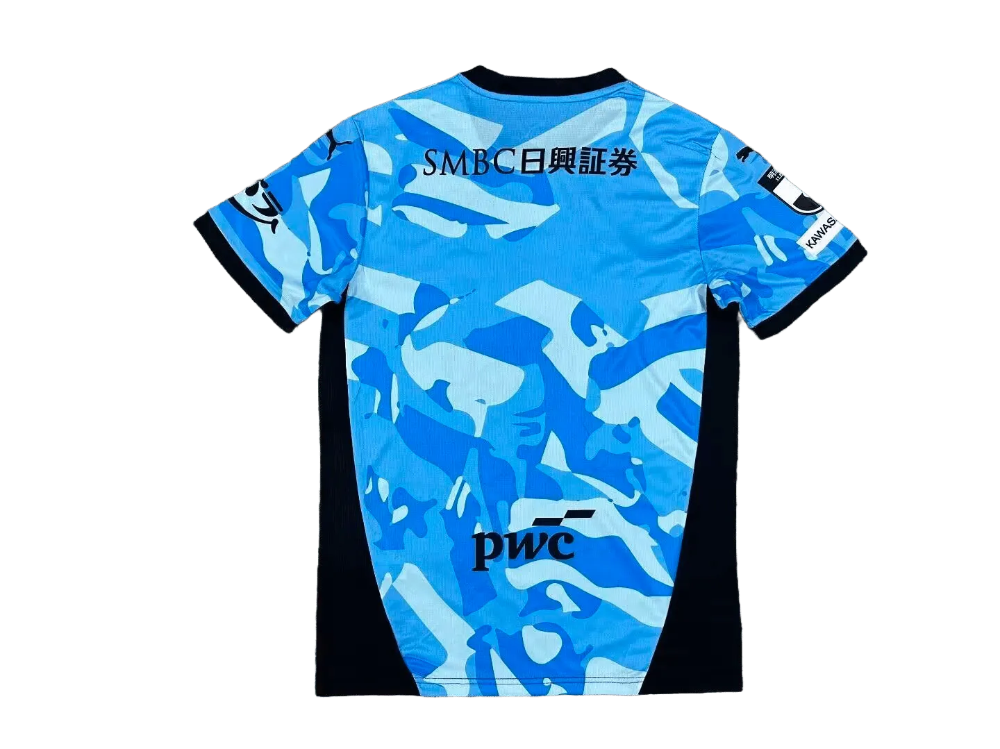 Kawasaki Frontale 2026/27 home jersey back view showing blue camo pattern and sponsor text across shoulders
