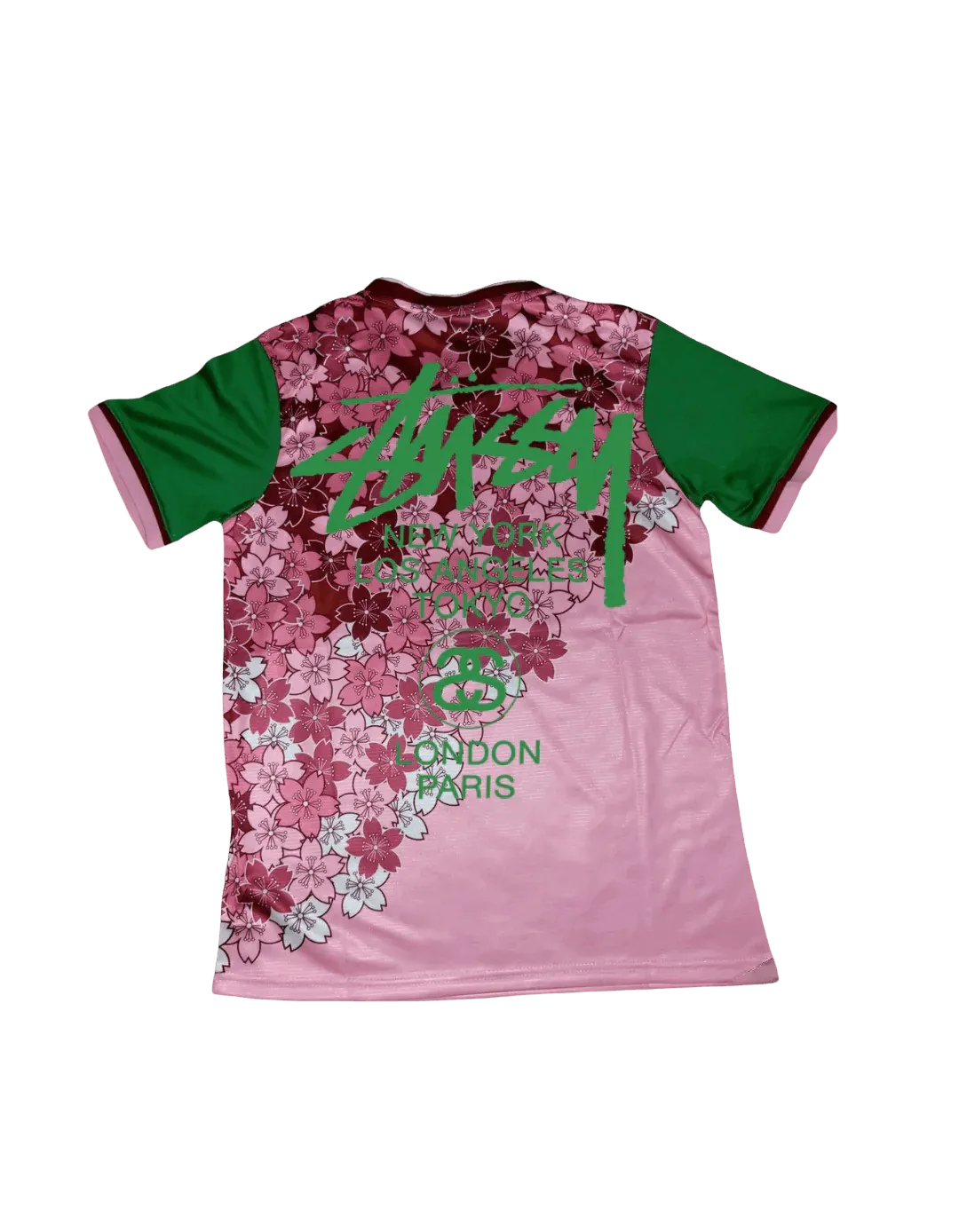 Pink Stussy Japan soccer jersey back with green Stussy Tokyo print